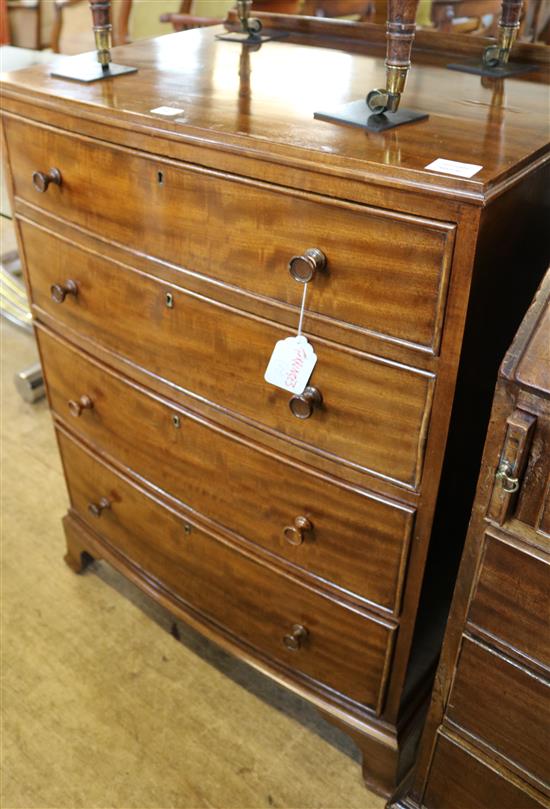 A slender bowfront chest of drawers